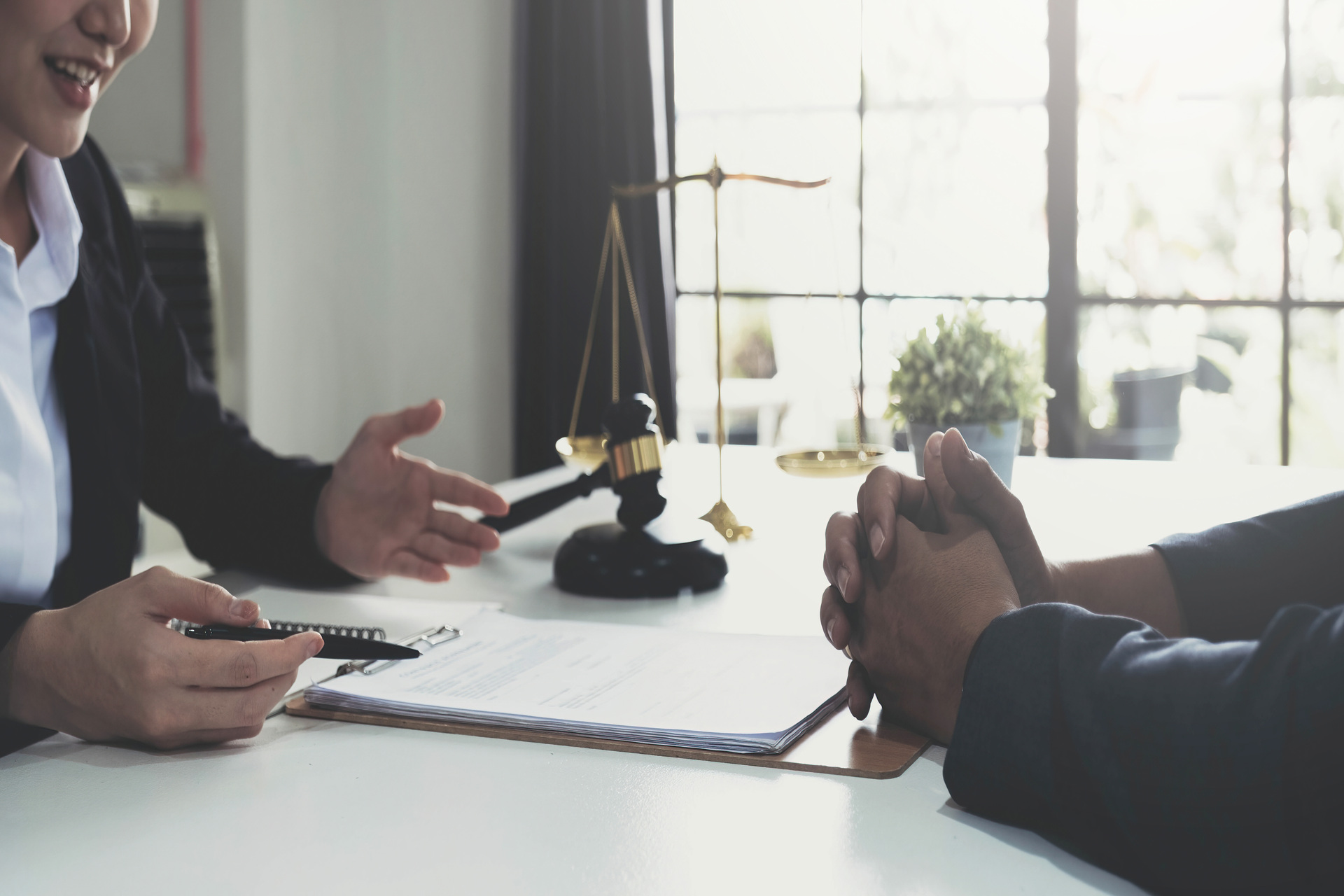 Woman consulting lawyer on legal papers Woman consulting lawyer on legal papers