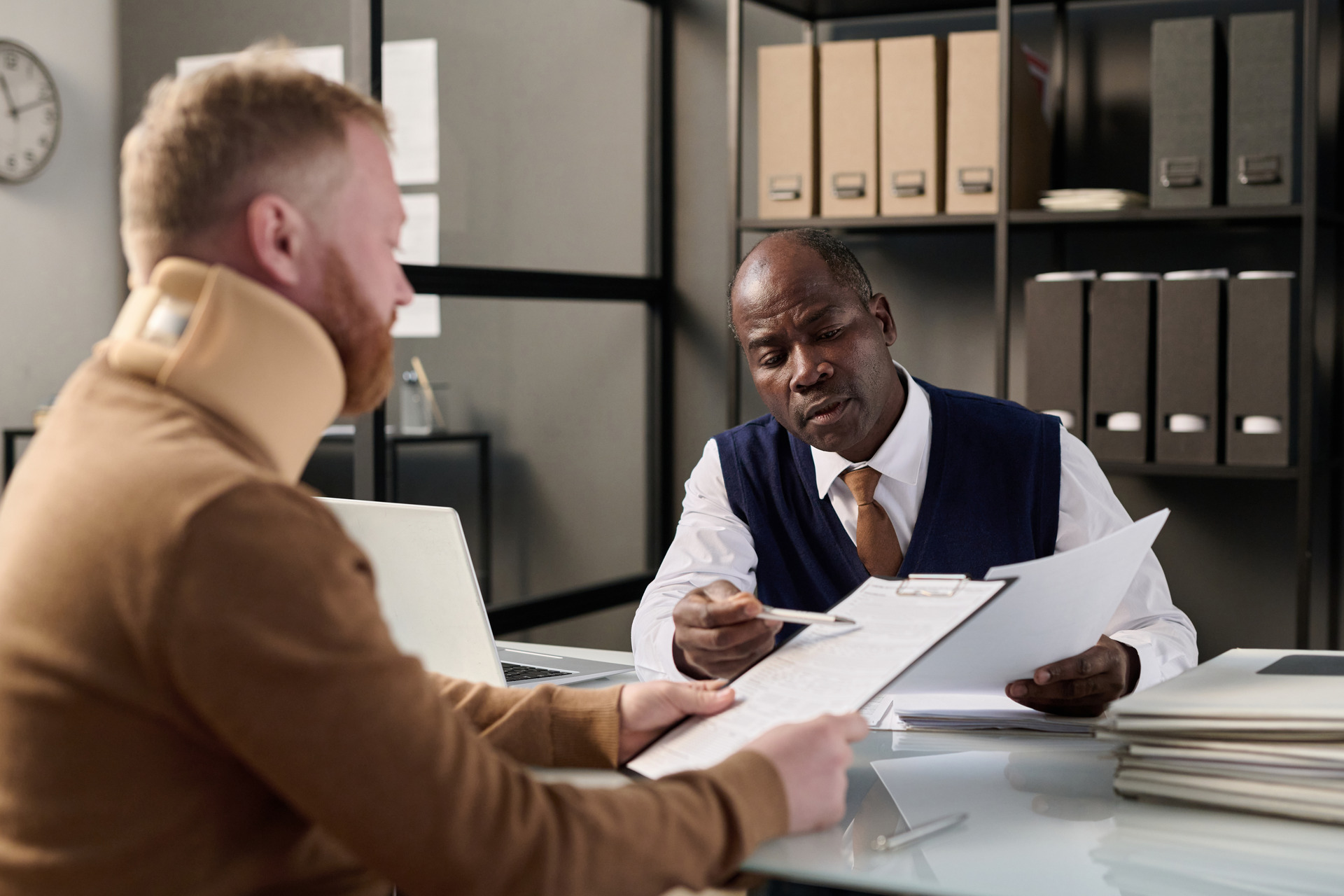lawyer helping man with neck injury lawyer helping man with neck injury